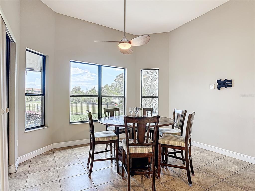 772 San Raphael Street Kissimmee, FL 34759 - Photo 23 of 94 a view of a dining room with furniture and a chandelier