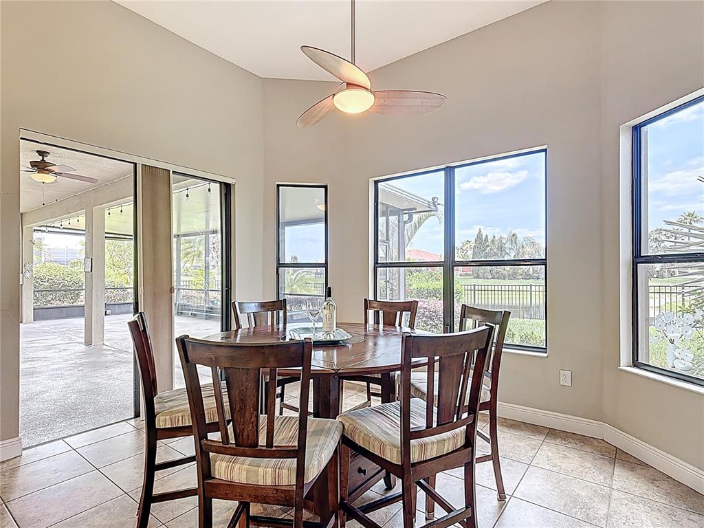 772 San Raphael Street Kissimmee, FL 34759 - Photo 24 of 94 a view of a dining room with furniture large windows and wooden floor