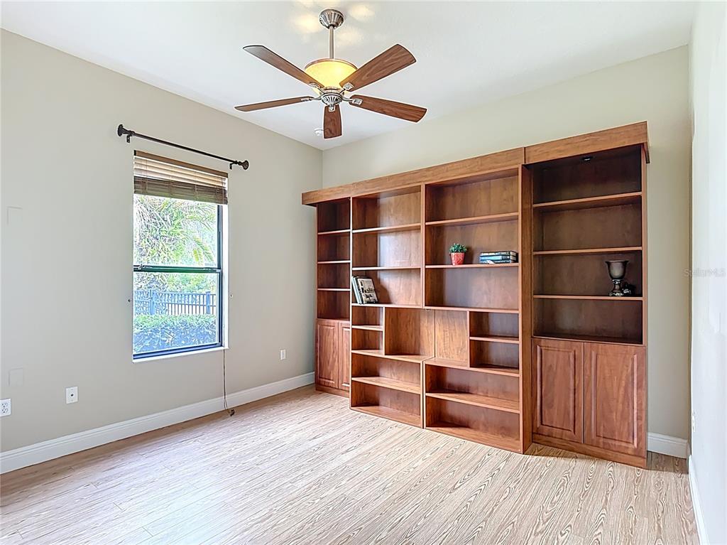 772 San Raphael Street Kissimmee, FL 34759 - Photo 36 of 94 a view of an empty room with a window and wooden floor