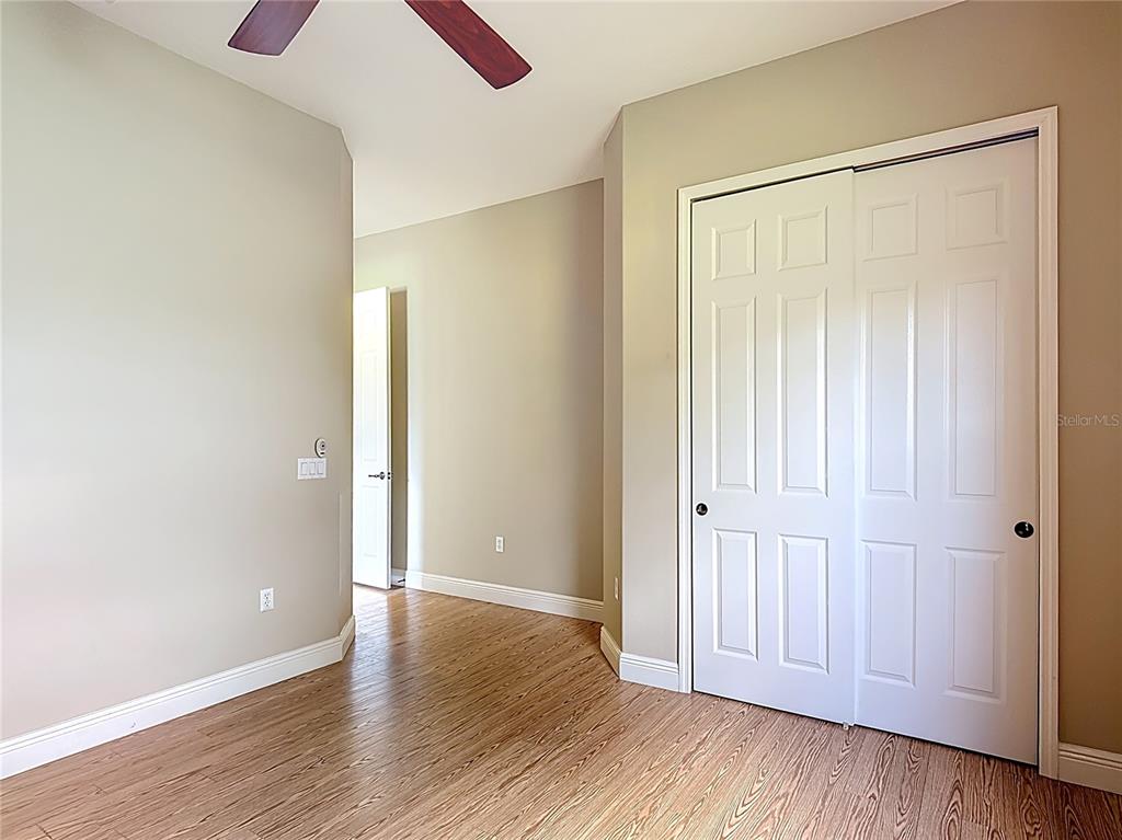 772 San Raphael Street Kissimmee, FL 34759 - Photo 38 of 94 an empty room with wooden floor and closet