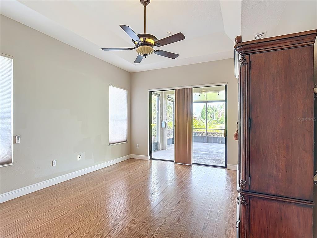 772 San Raphael Street Kissimmee, FL 34759 - Photo 43 of 94 a view of an empty room with wooden floor and a window