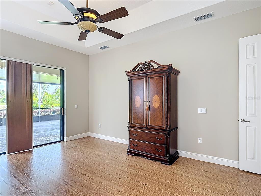 772 San Raphael Street Kissimmee, FL 34759 - Photo 44 of 94 an empty room with wooden floor closet and windows