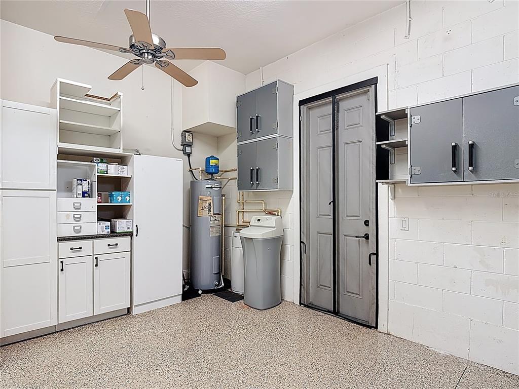 772 San Raphael Street Kissimmee, FL 34759 - Photo 54 of 94 a room with refrigerator and cabinets