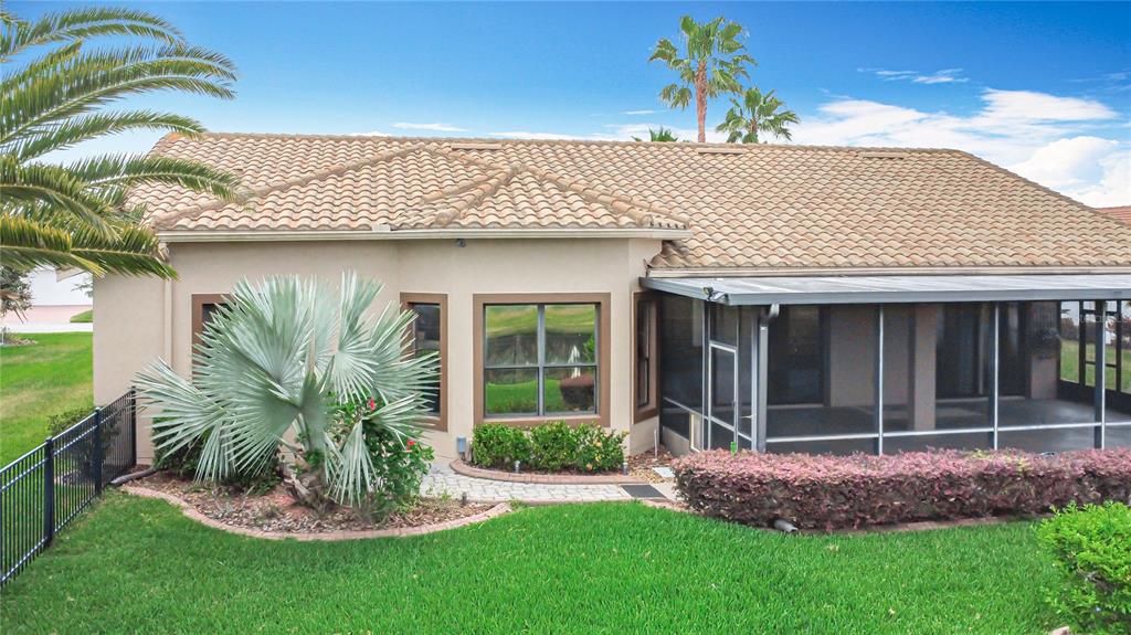 772 San Raphael Street Kissimmee, FL 34759 - Photo 59 of 94 a front view of a house with a garden