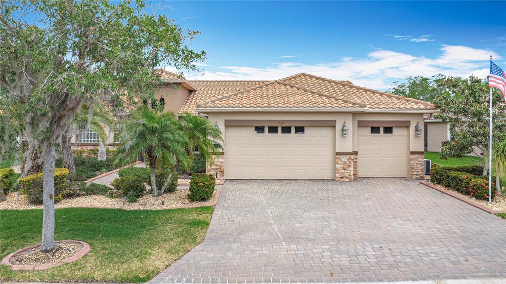 772 San Raphael Street Kissimmee, FL 34759 - Photo 6 of 94 a view of a house with a yard and potted plants