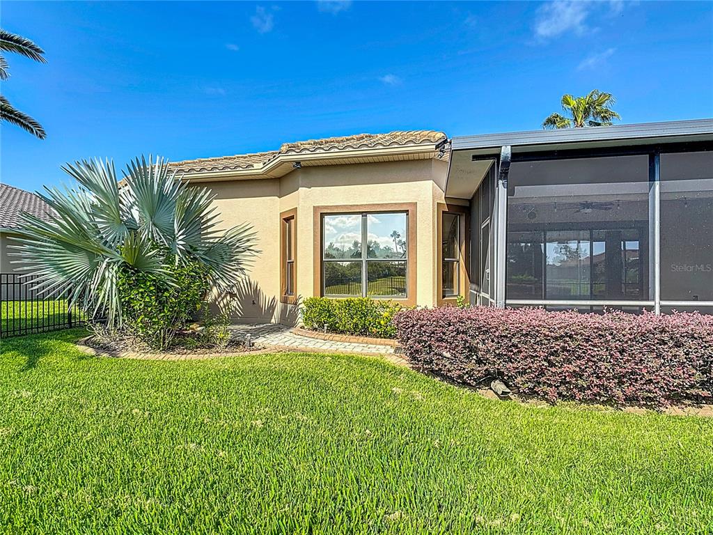 772 San Raphael Street Kissimmee, FL 34759 - Photo 76 of 94 a front view of a house with a yard