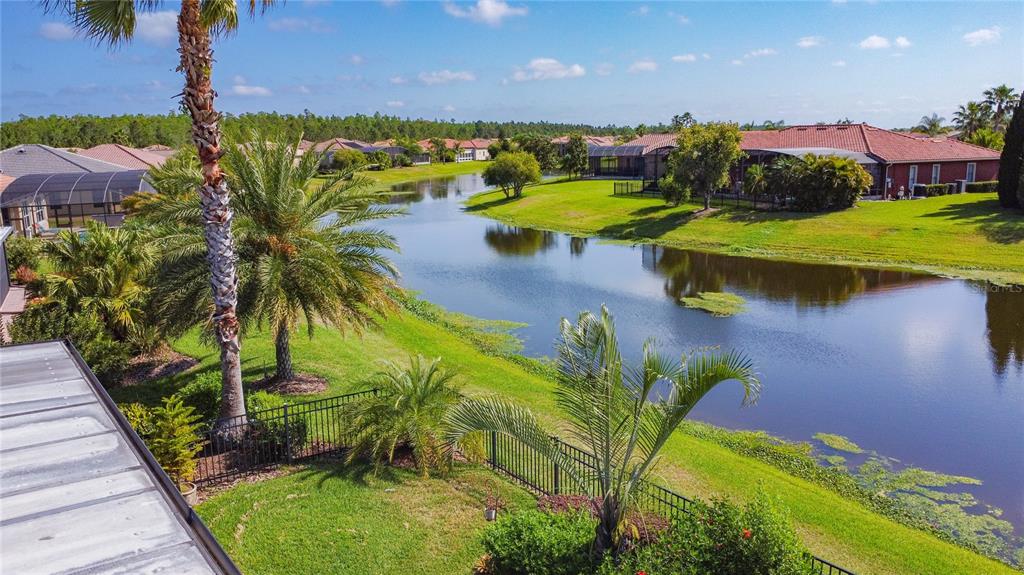 772 San Raphael Street Kissimmee, FL 34759 - Photo 92 of 94 a view of a lake with a building in the background
