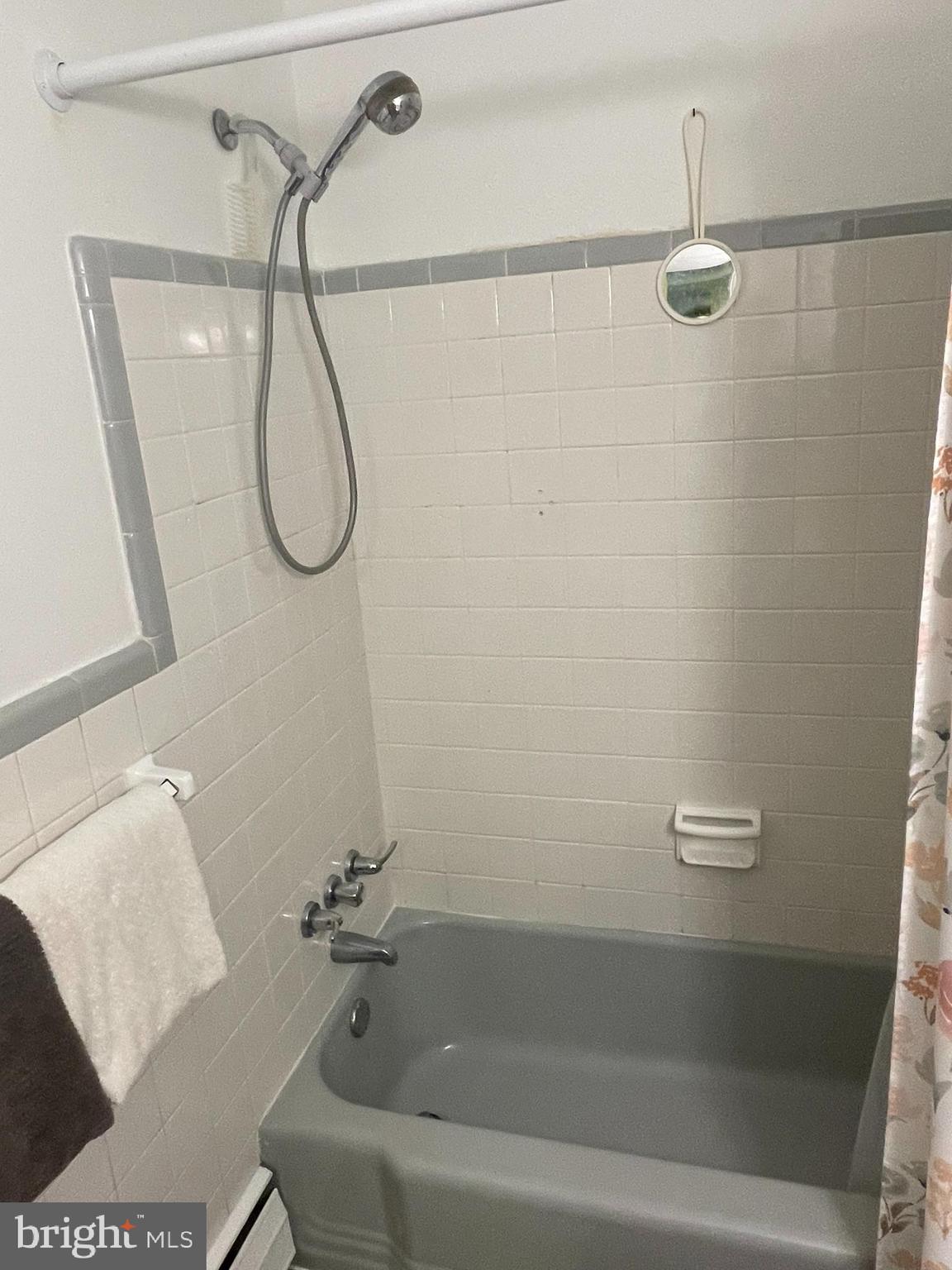 420 North Wayne Avenue, Unit 8 Wayne, PA 19087 - Photo 11 of 18 a bathroom with a bath tub with a shower