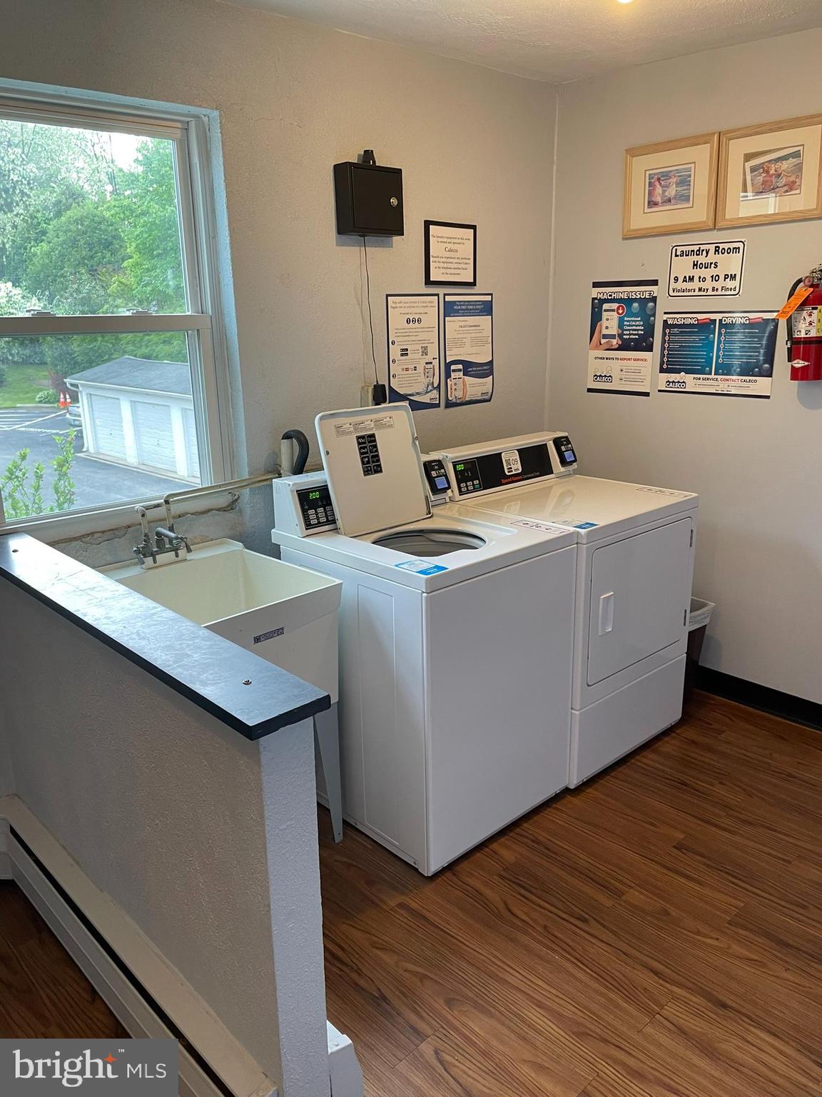 420 North Wayne Avenue, Unit 8 Wayne, PA 19087 - Photo 17 of 18 a living room with hard wood floors and a table