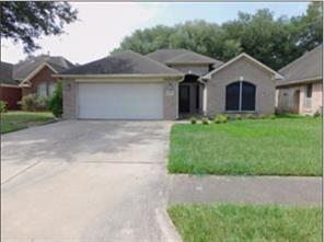5015 Misty Lane Pasadena, TX 77505 - Photo 1 of 12 a front view of a house with a garden and yard