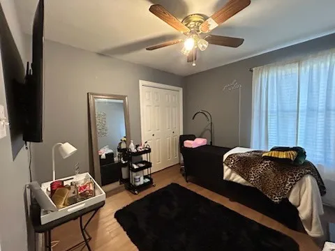 a bedroom with furniture and a chandelier