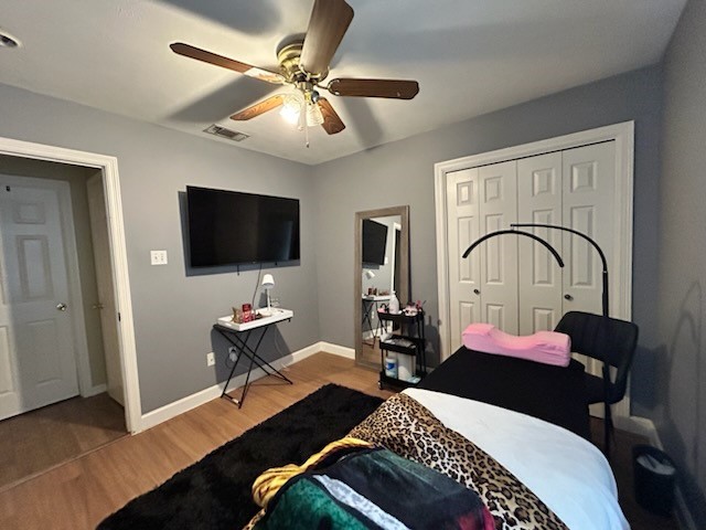 5015 Misty Lane Pasadena, TX 77505 - Photo 6 of 12 a bedroom with a bed and a flat screen tv