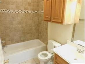 5015 Misty Lane Pasadena, TX 77505 - Photo 10 of 12 a bathroom with a sink and a bathtub