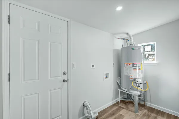 a room that has a bed and a chair in it