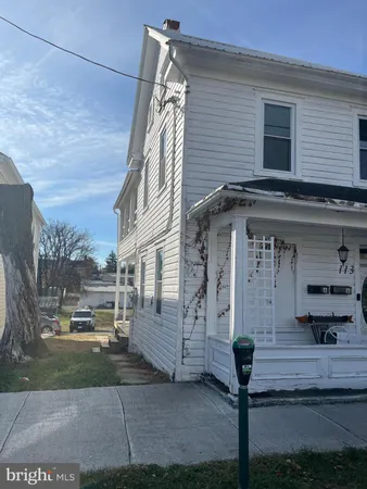 a front view of a house with garage