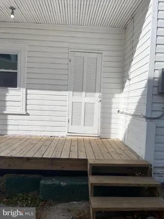 a view of backyard with wooden deck