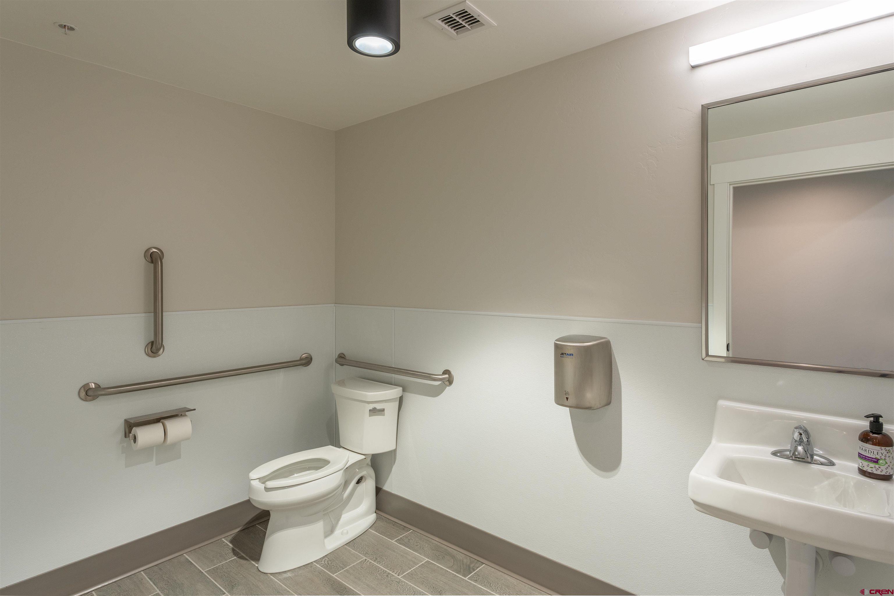 322 Belleview Avenue Crested Butte, CO 81224 - Photo 24 of 43 a white toilet sitting next to a bathroom sink