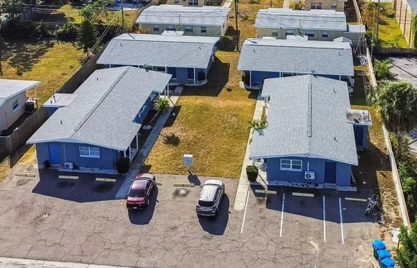 an aerial view of a house with sitting space and seating area