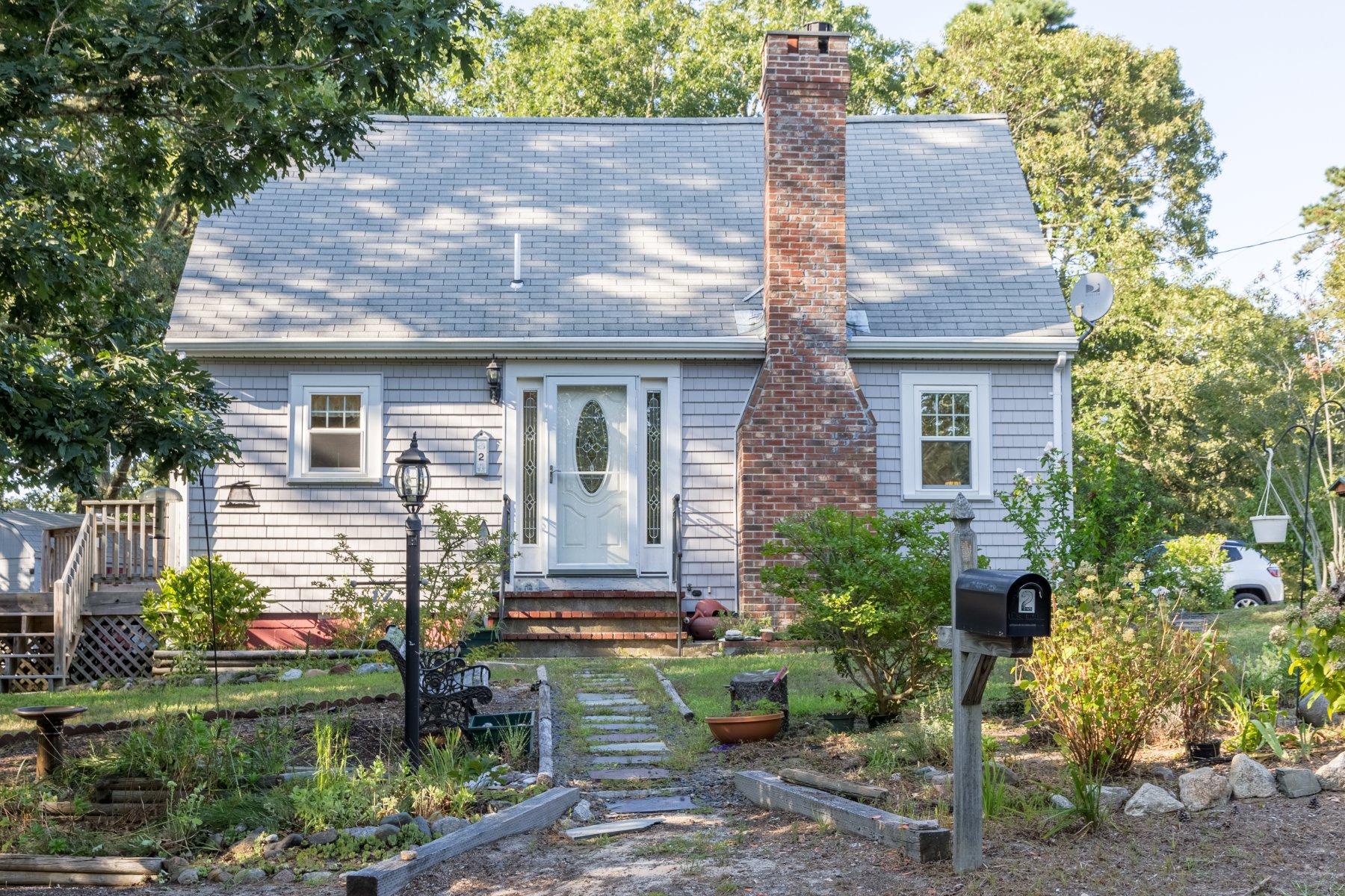 2 Otis Kelly Road Dennis Port, MA 02639 - Photo 1 of 23 a front view of a house with garden