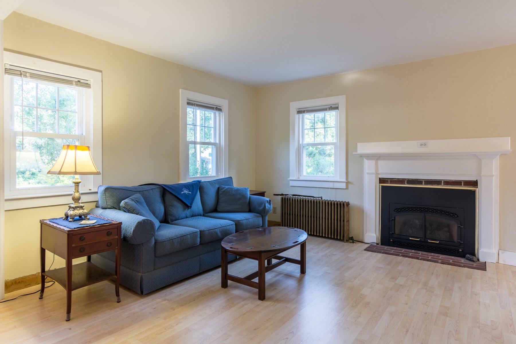 2 Otis Kelly Road Dennis Port, MA 02639 - Photo 11 of 23 a living room with furniture a window and a fireplace