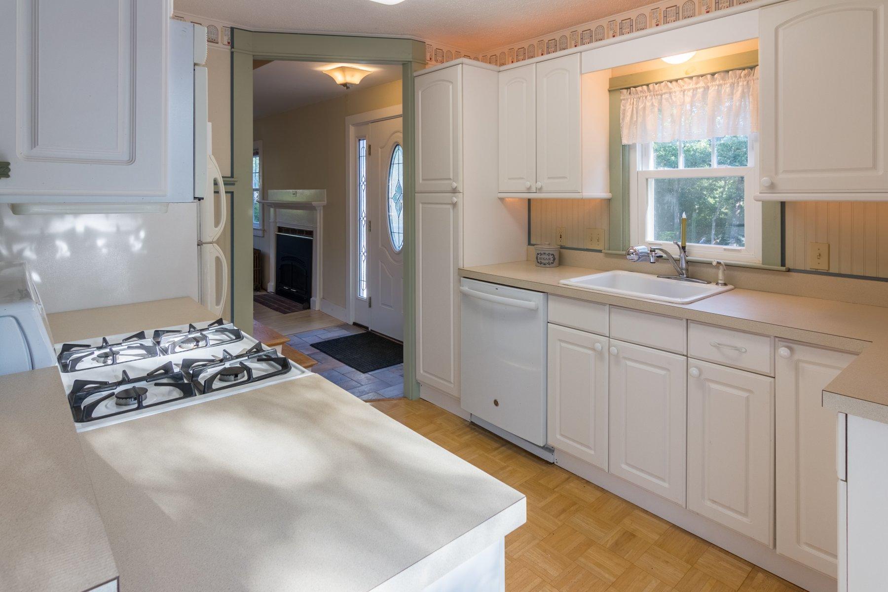 2 Otis Kelly Road Dennis Port, MA 02639 - Photo 14 of 23 a kitchen with a stove a refrigerator and a sink