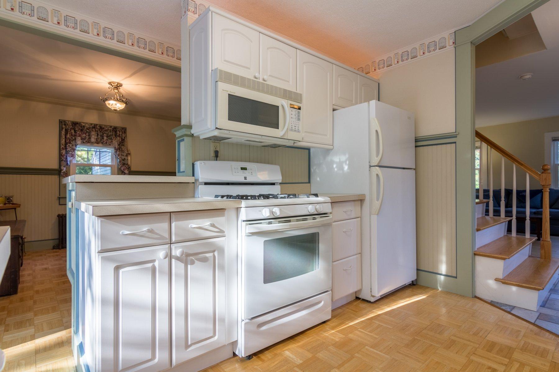 2 Otis Kelly Road Dennis Port, MA 02639 - Photo 15 of 23 a kitchen with a refrigerator sink and microwave