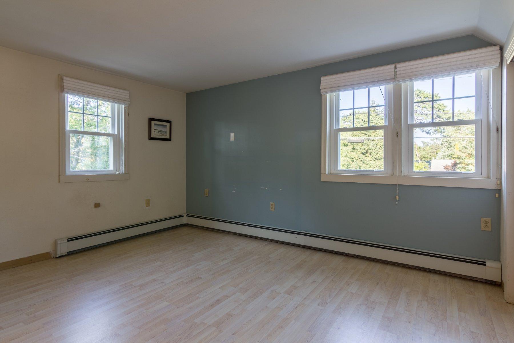 2 Otis Kelly Road Dennis Port, MA 02639 - Photo 19 of 23 a view of an empty room with wooden floor and a window