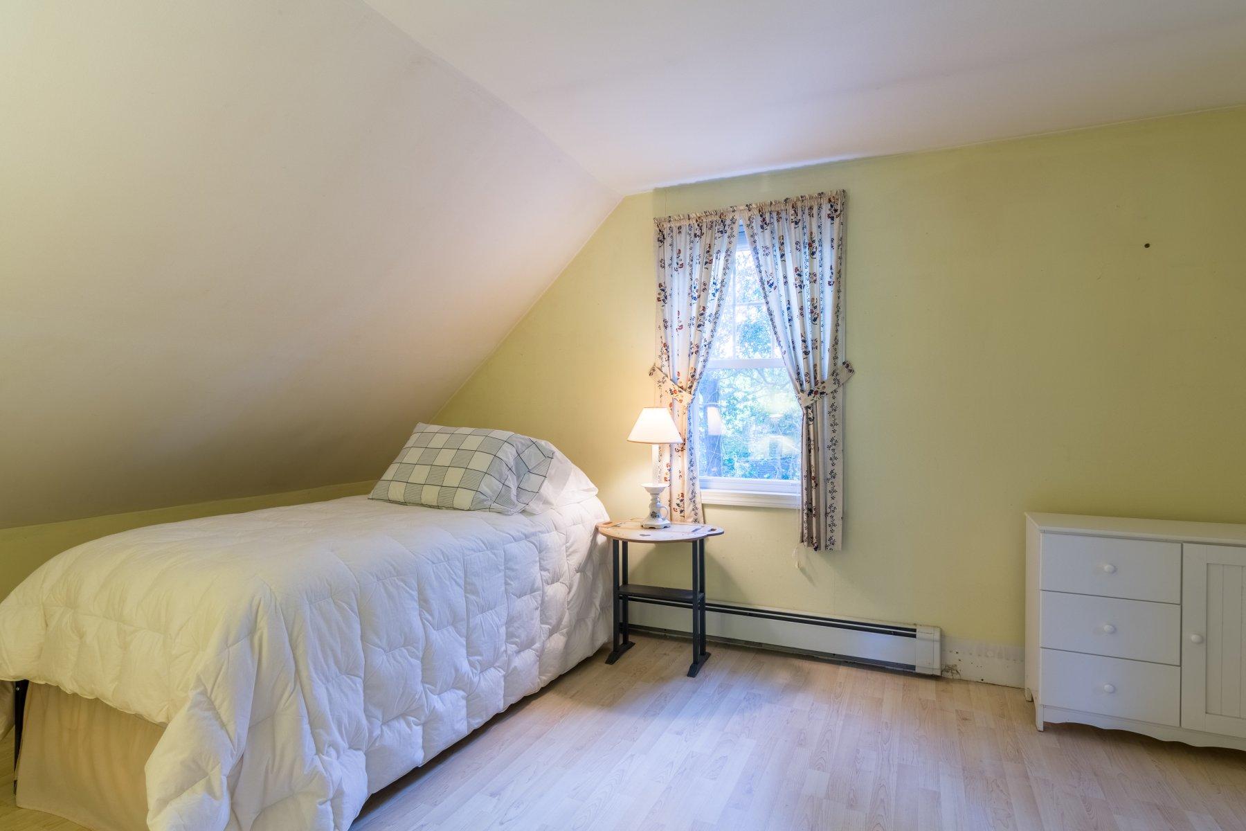 2 Otis Kelly Road Dennis Port, MA 02639 - Photo 21 of 23 a bedroom with a bed and a window