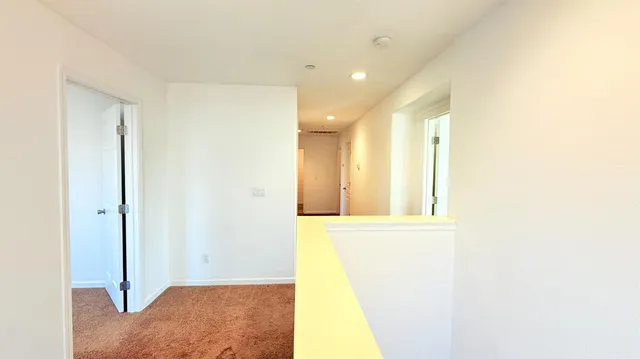 a view of a hallway with a window