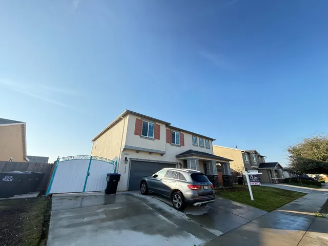 a car parked in front of a house