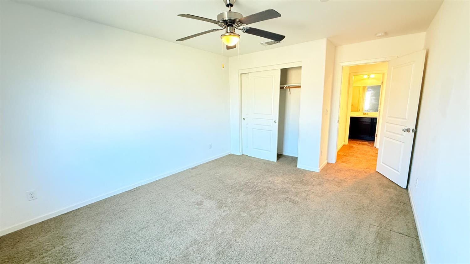 3935 East Myrtle Avenue Visalia, CA 93292 - Photo 34 of 41 a view of a big room with closet and chandelier fan