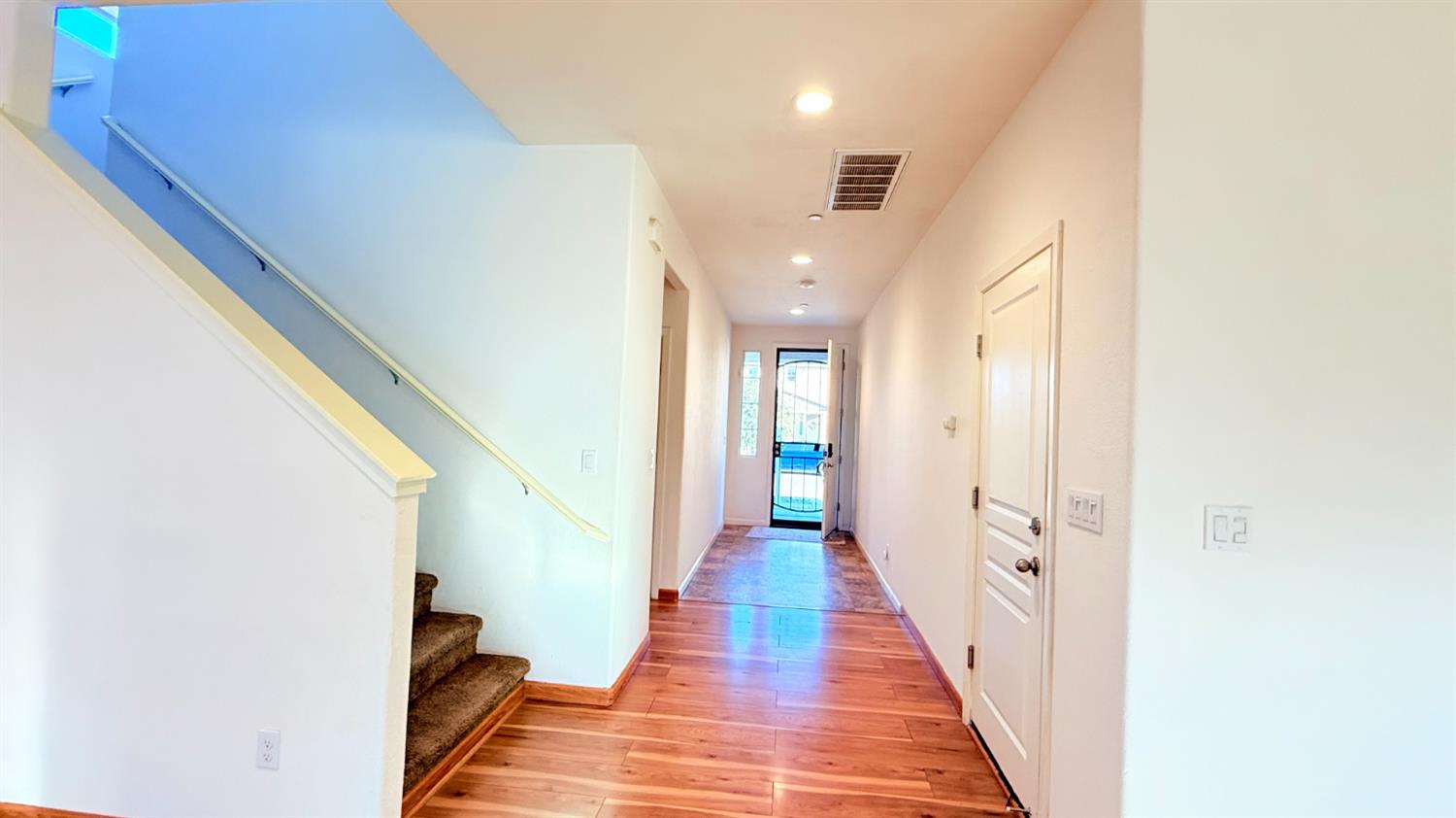 3935 East Myrtle Avenue Visalia, CA 93292 - Photo 9 of 41 a view of a hallway with wooden floor