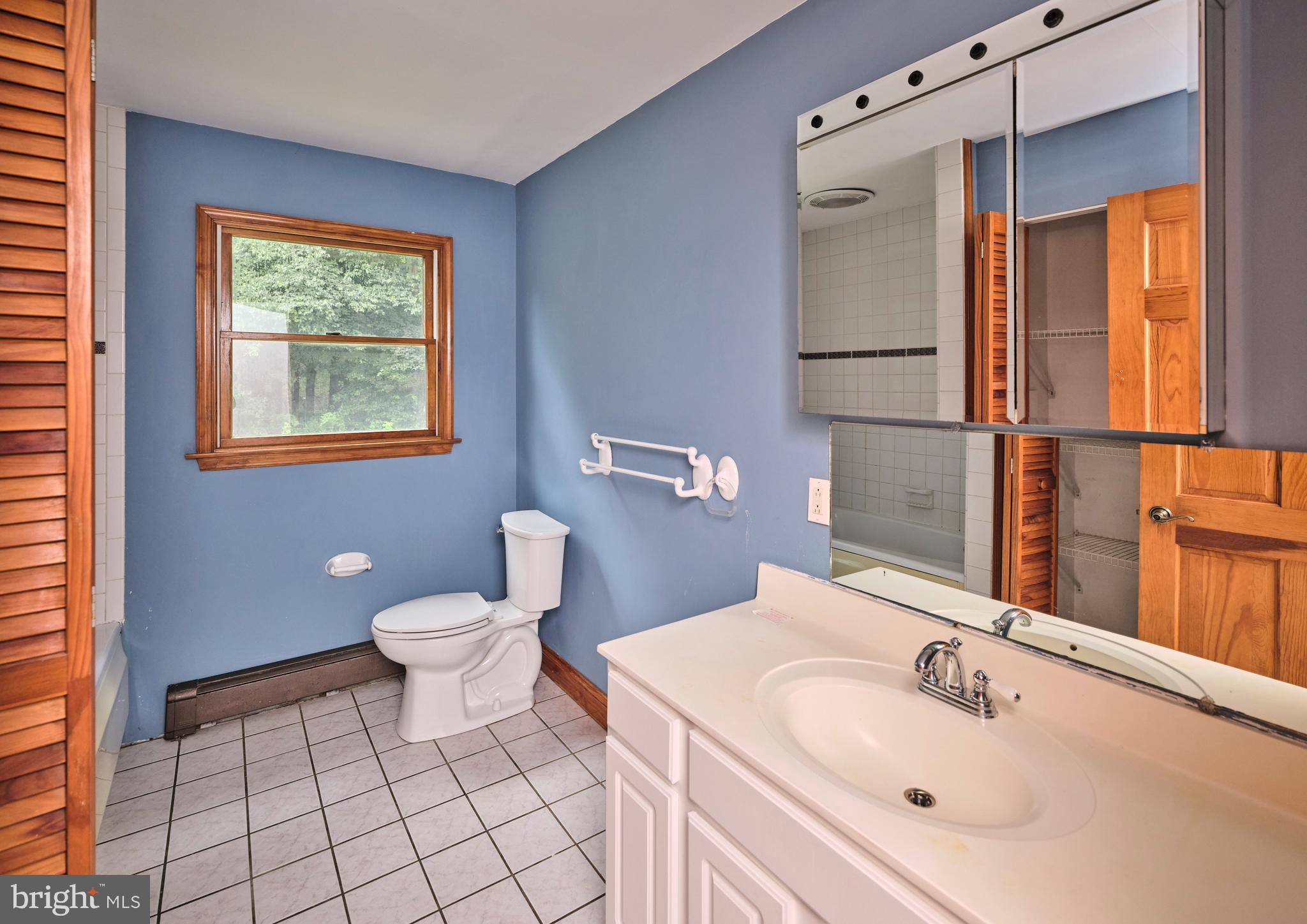 130 Rattlesnake Road Kintnersville, PA 18930 - Photo 20 of 29 a bathroom with a sink toilet and shower