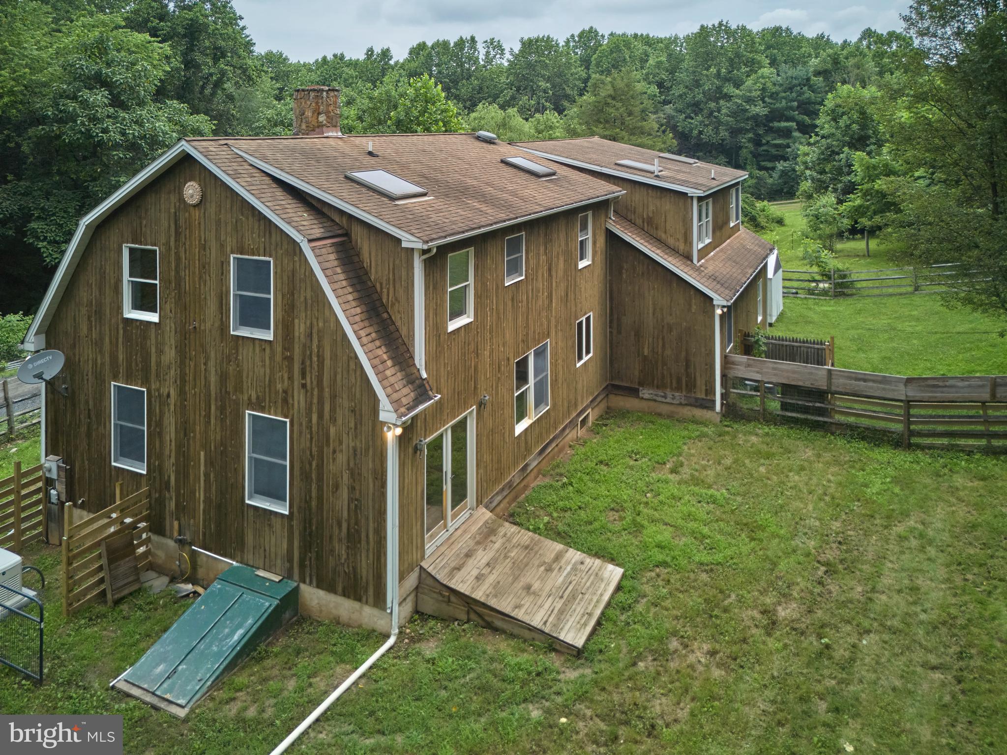 130 Rattlesnake Road Kintnersville, PA 18930 - Photo 2 of 29 a aerial view of a house with a yard table and chairs