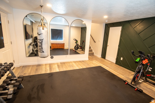 1373 South Raintree Lane Santaquin, UT 84655 - Photo 17 of 29 Exercise room with light wood-type flooring and a decorative wall