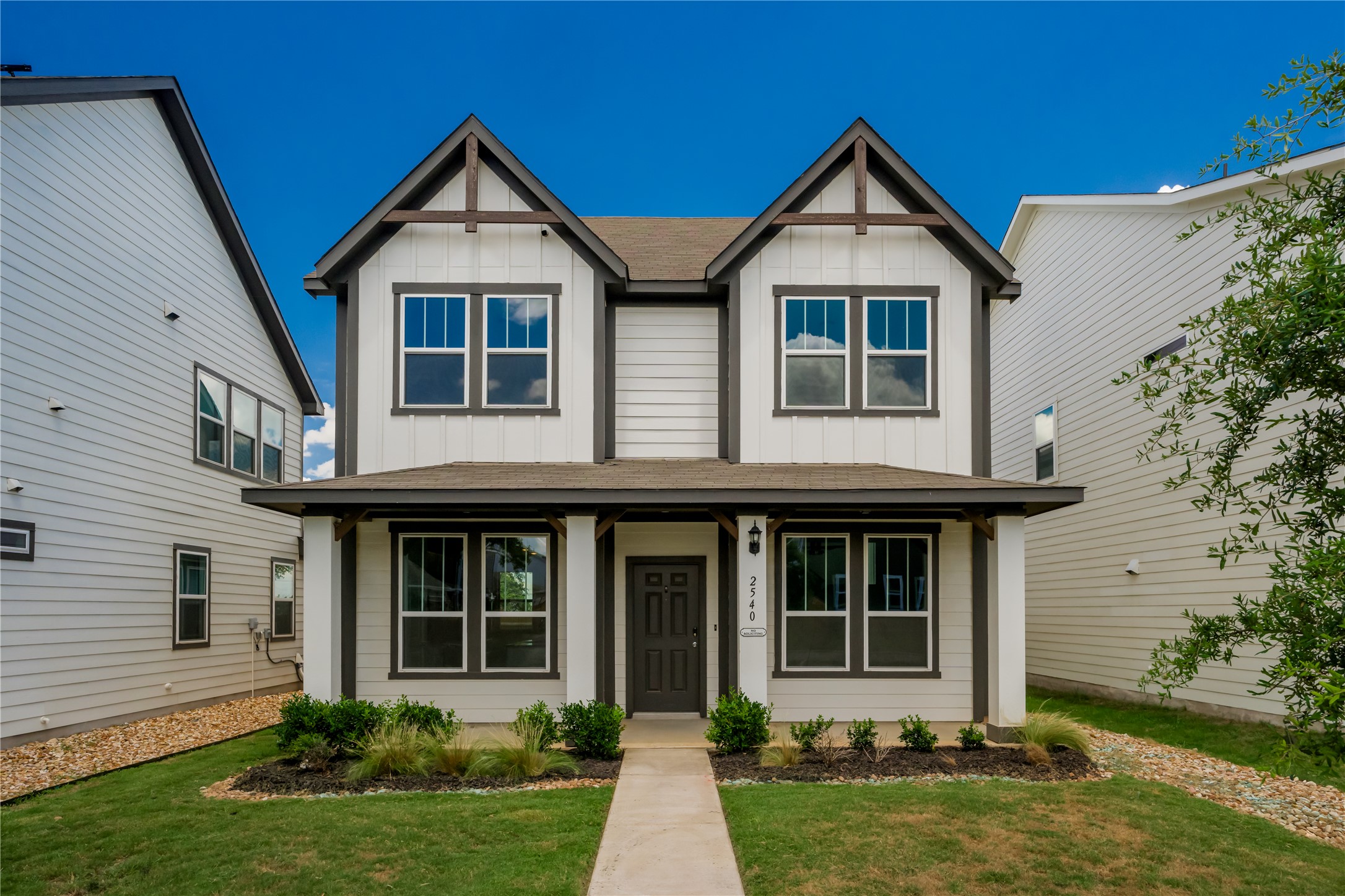 front view of a house with a yard