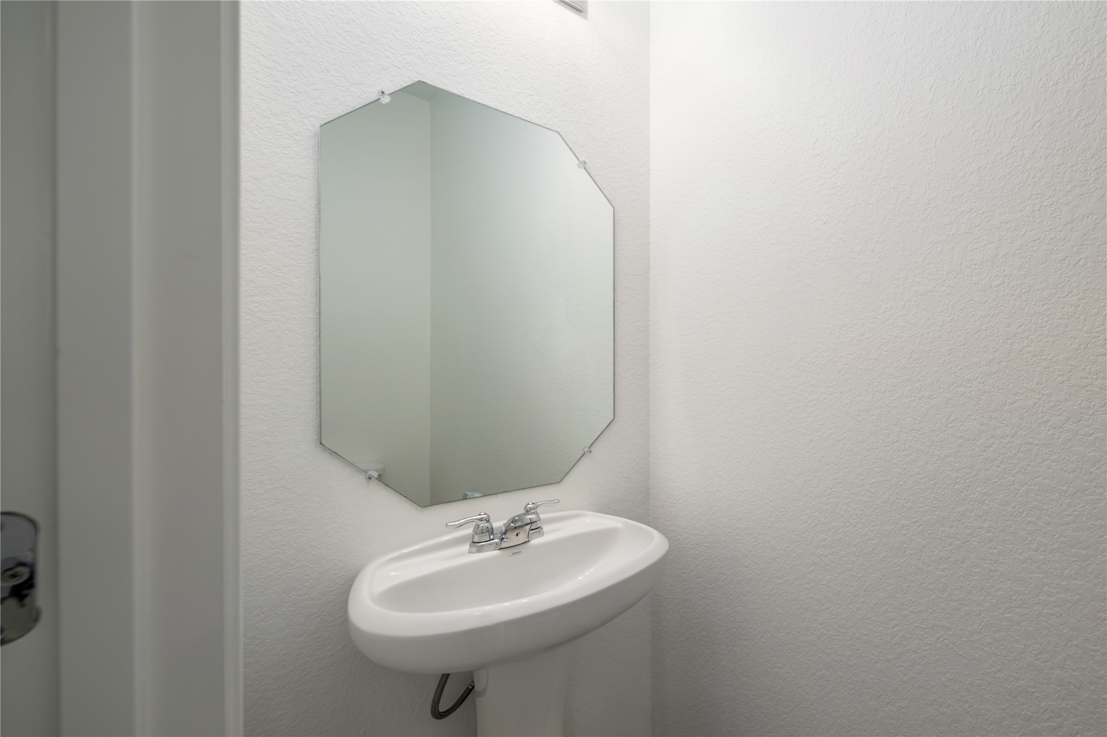 2540 Acoma Lane Leander, TX 78641 - Photo 21 of 26 a bathroom with a sink and a mirror