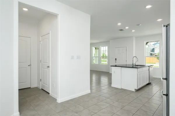 a view of kitchen with center island and natural light