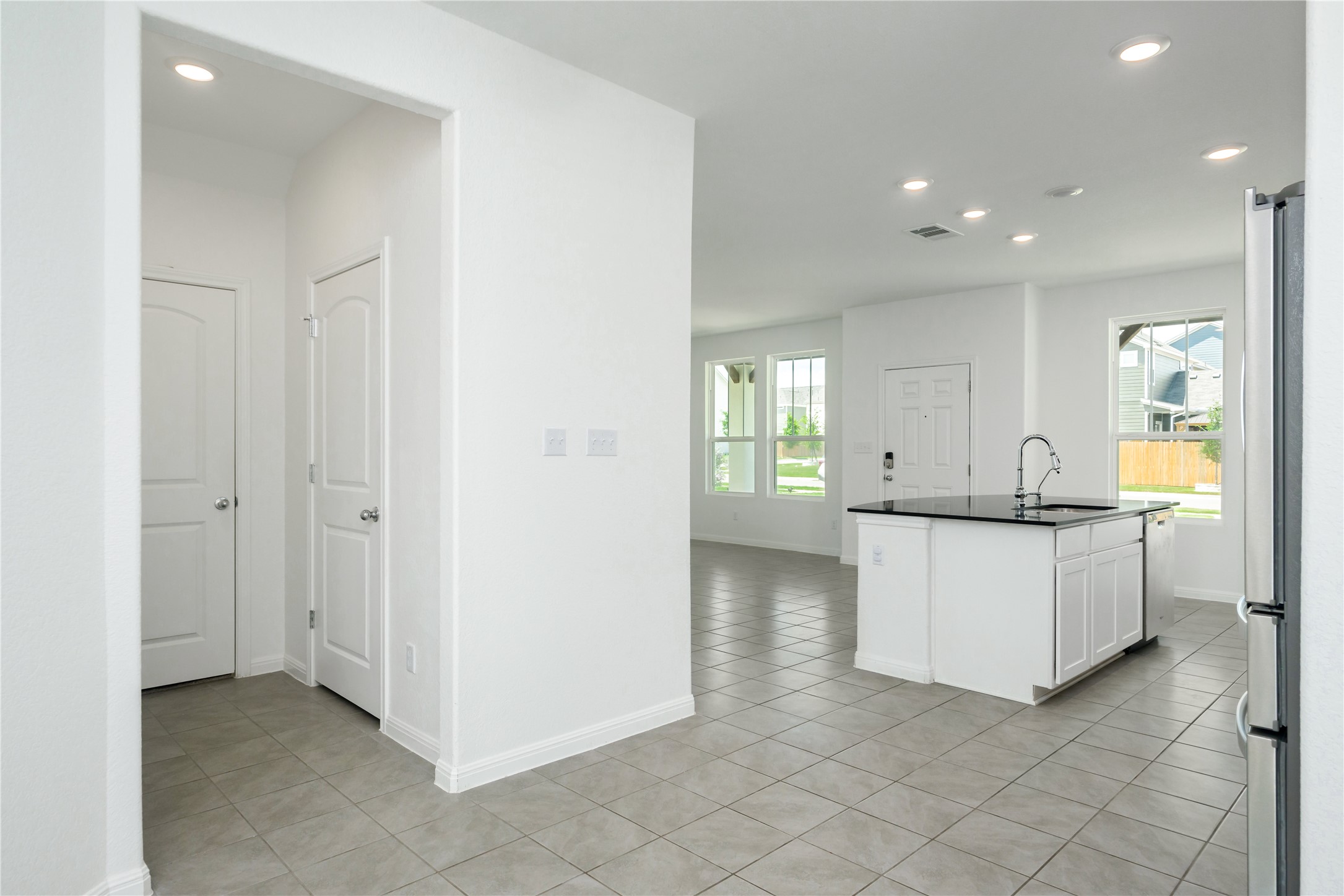 2540 Acoma Lane Leander, TX 78641 - Photo 8 of 26 a view of kitchen with center island and natural light