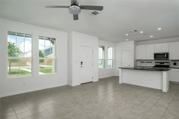 a view of a kitchen with a stove cabinets and a kitchen