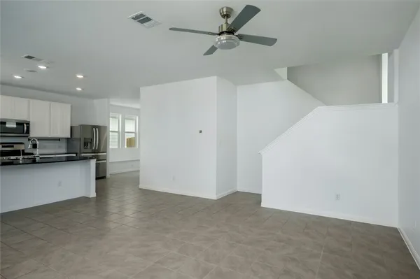 a view of a kitchen with a sink and cabinets