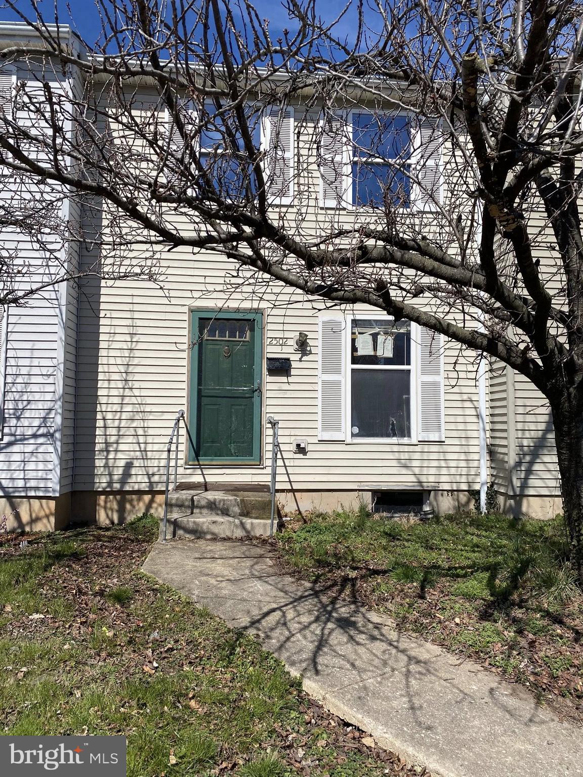 2502 Huron Street Baltimore, MD 21230 - Photo 1 of 14 a front view of a house with a yard