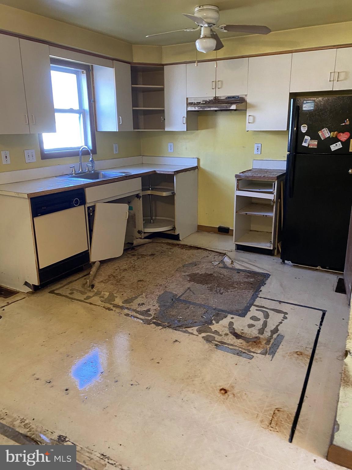 2502 Huron Street Baltimore, MD 21230 - Photo 12 of 14 a kitchen with stainless steel appliances a stove a sink cabinets and wooden floor