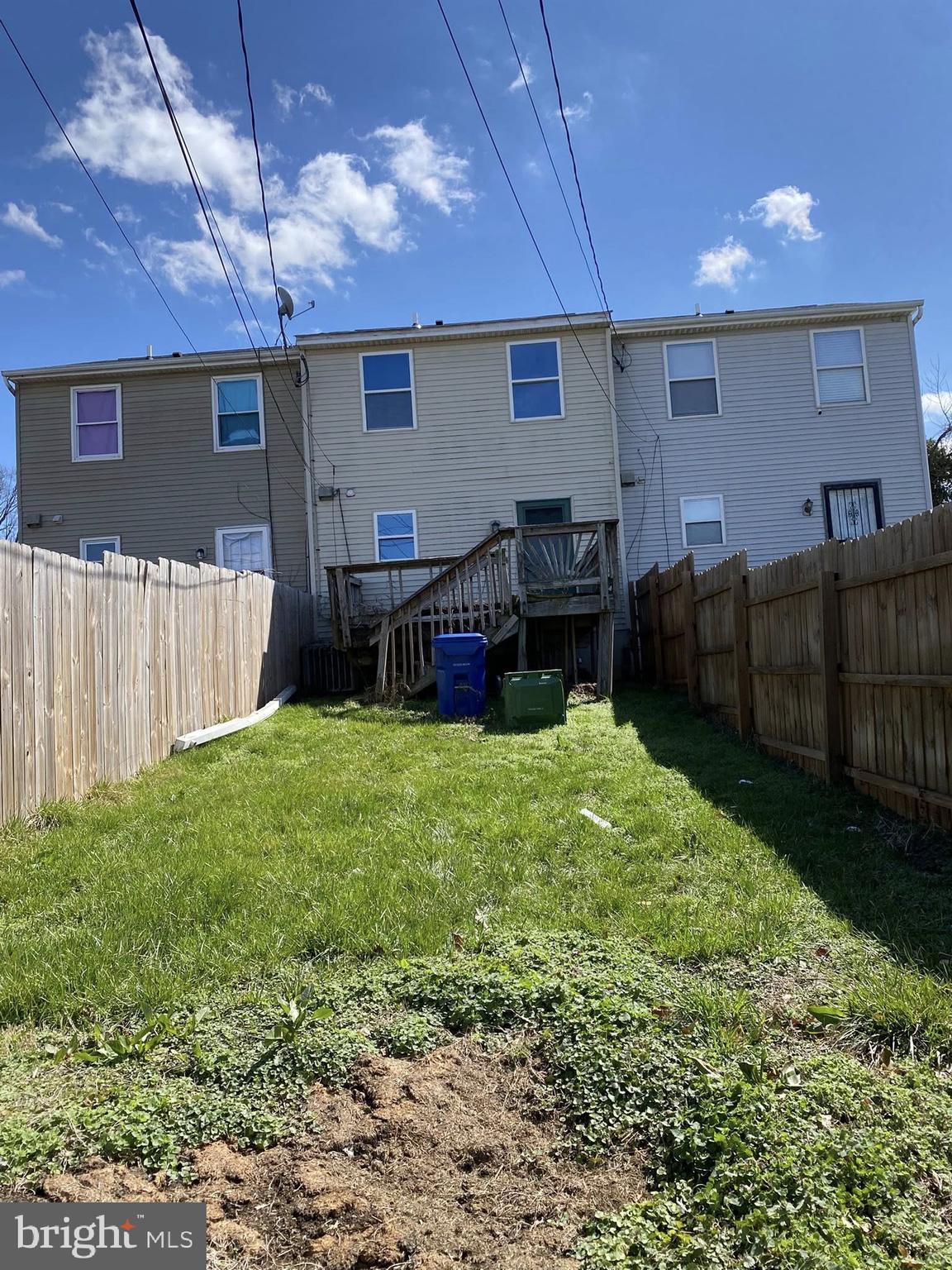 2502 Huron Street Baltimore, MD 21230 - Photo 14 of 14 a backyard of a house with yard and outdoor seating