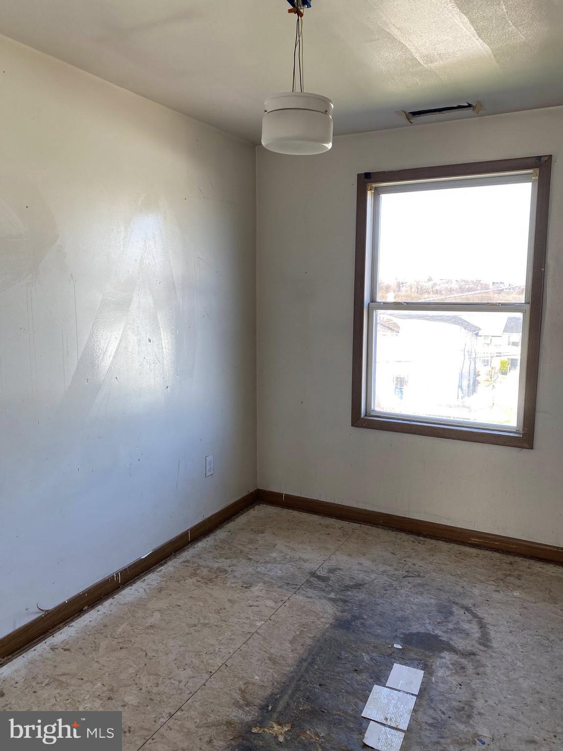 2502 Huron Street Baltimore, MD 21230 - Photo 7 of 14 an empty room with a window