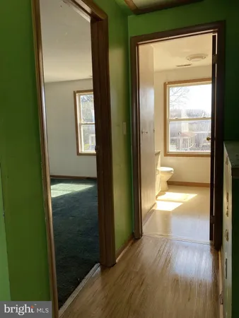 a view of hallway with natural light