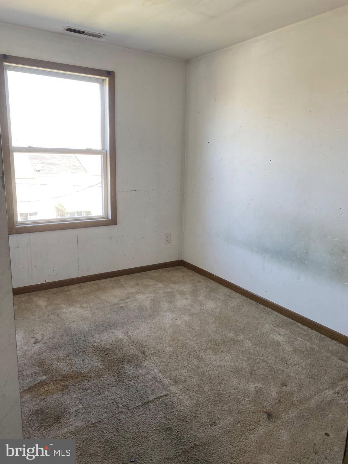 2502 Huron Street Baltimore, MD 21230 - Photo 9 of 14 an empty room with a window