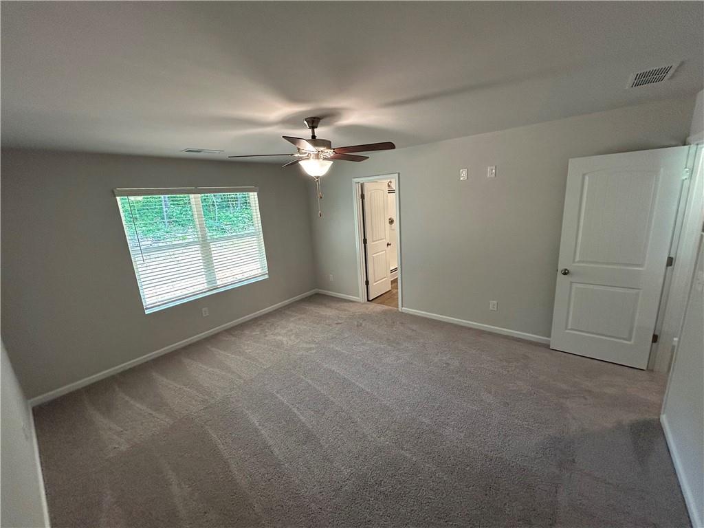 27 Stonebrook Drive Rome, GA 30165 - Photo 17 of 22 an empty room with windows ceiling fan and windows