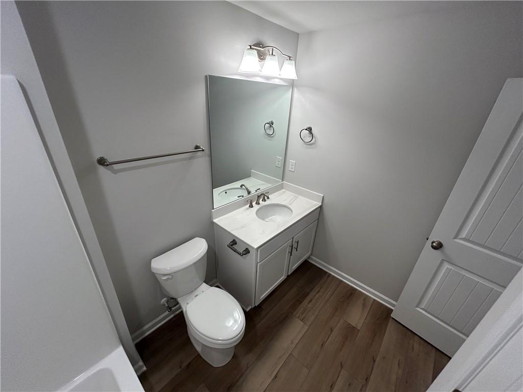 27 Stonebrook Drive Rome, GA 30165 - Photo 20 of 22 a bathroom with a toilet sink and mirror