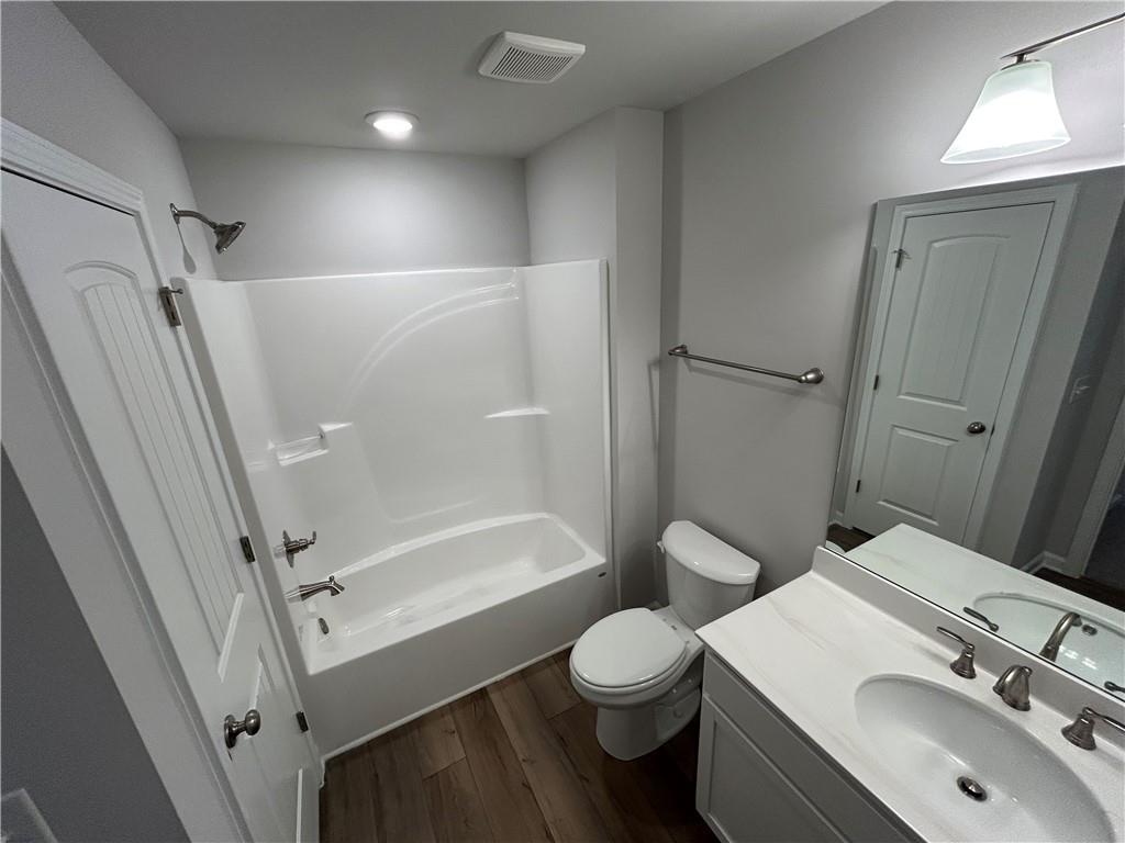 27 Stonebrook Drive Rome, GA 30165 - Photo 21 of 22 a bathroom with a sink toilet and shower
